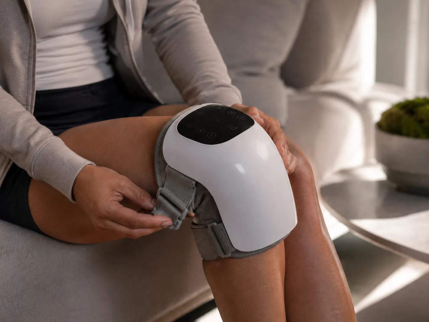 FlexiKnee Smart Heated Knee Massager in use during a comfort routine